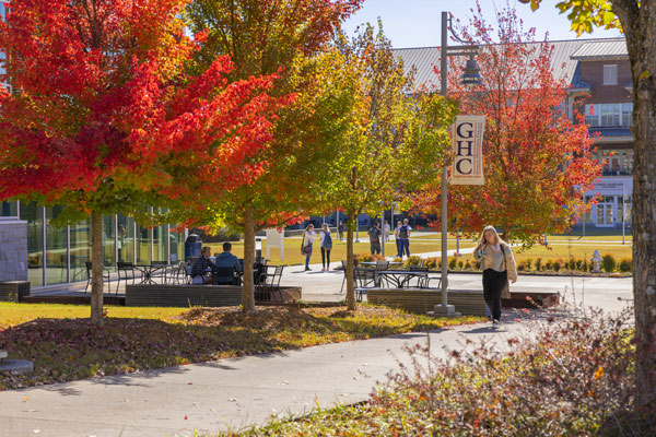 Cartersville campus in fall with colorful leaves. Students walking to classes.